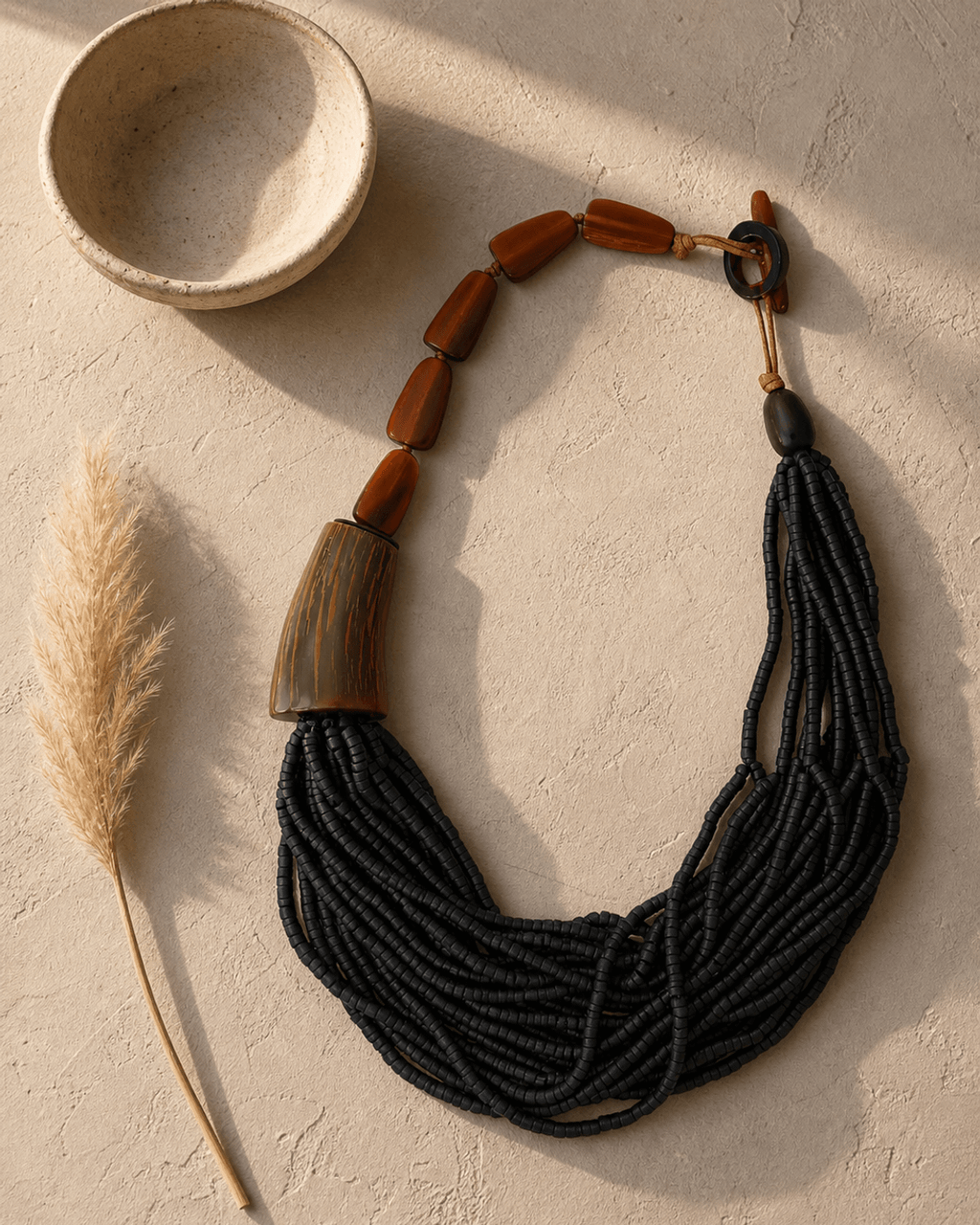 Asymmetric Horn and Coconut Bead Cascade Necklace