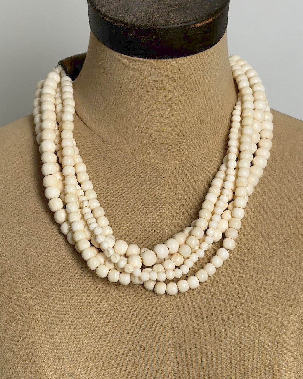 Five-Strand Cream Bone Necklace, Carved Horn Terminals