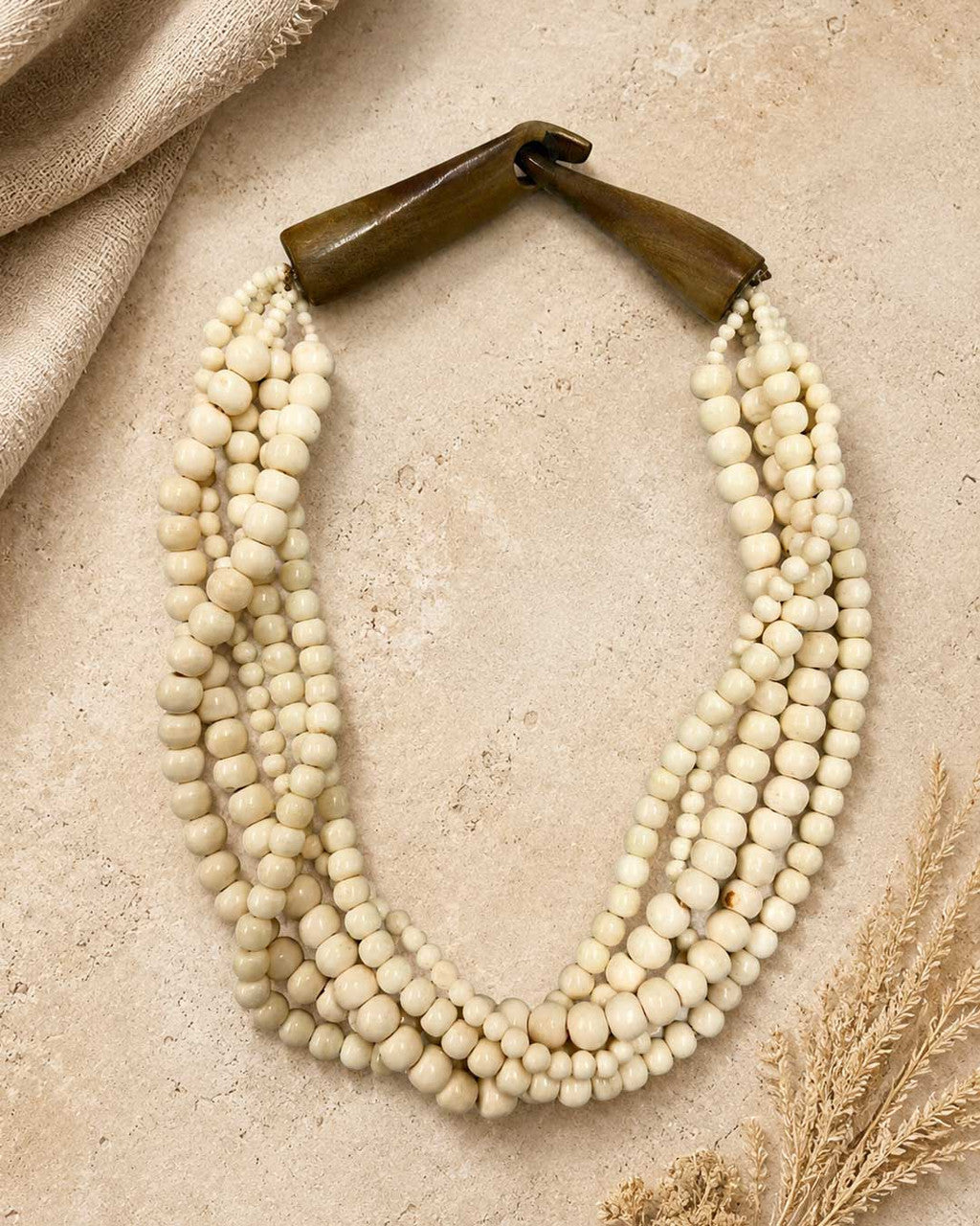 Five-Strand Cream Bone Necklace, Carved Horn Terminals