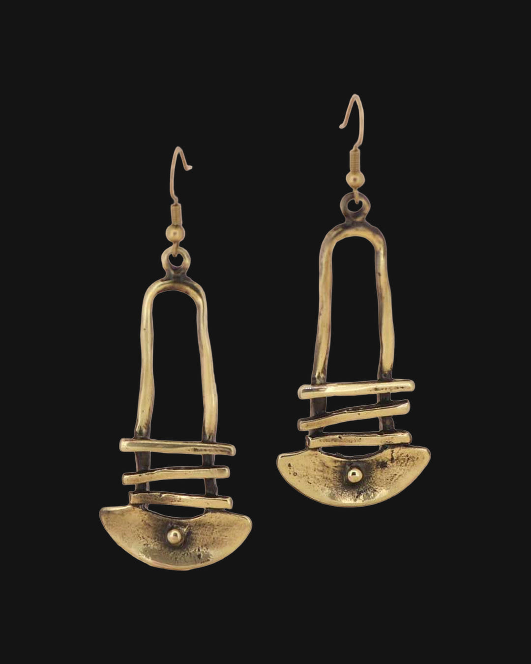 Bronze dangle earrings with arch, bars and half-moon shapes, hand-forged metalwork from Türkiye, on blush pink, shown on a black background
