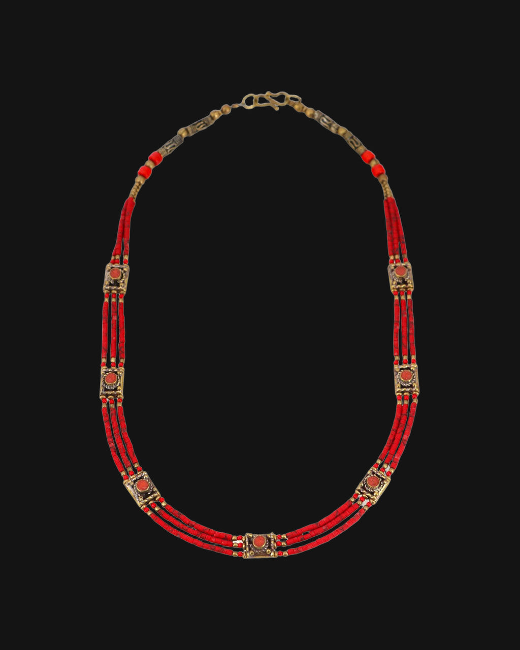 Full view of the Red heishi collar necklace with brass station beads and hook clasp, shown on a black background