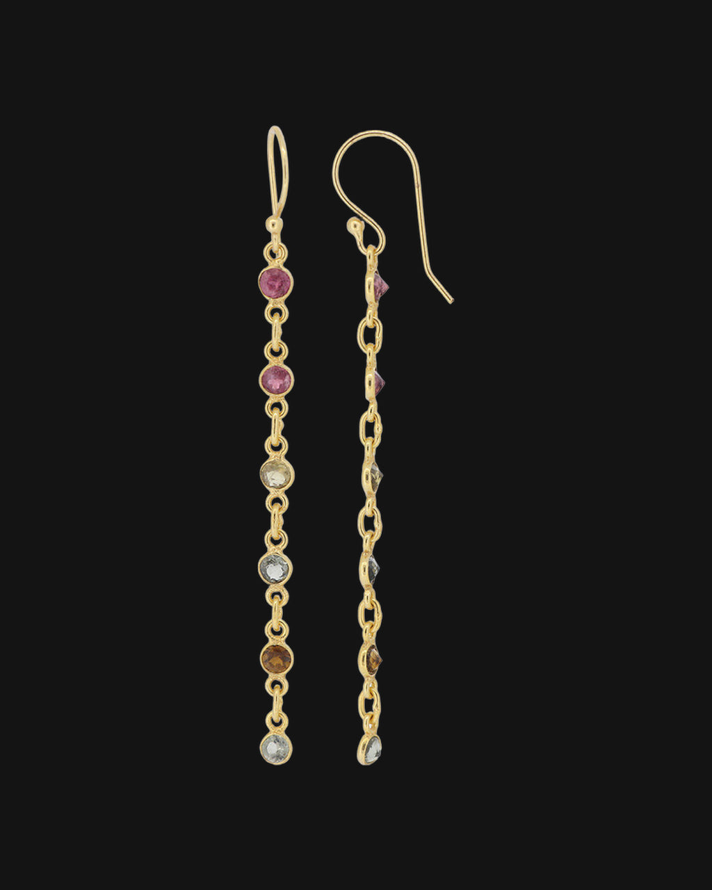 Six-stone tourmaline chain drop earrings with bezel-set stones on gold-plated brass, handmade in India, shown on a black background