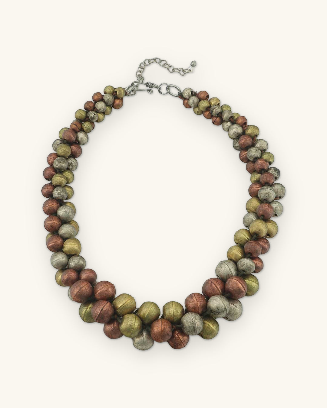 Twisted copper, gold and silver-tone bead collar necklace with lobster clasp and extender chain, shown on a sand background