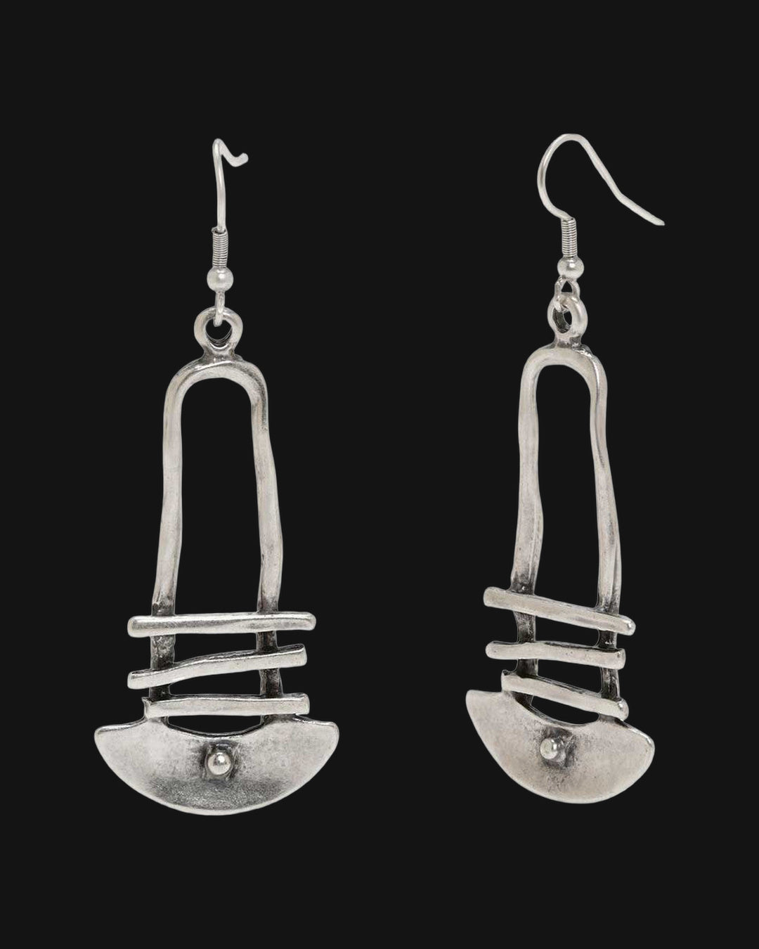 Silver-tone arch earrings with three crossbars and a dotted crescent on fish-hook ear wires, shown on a black background