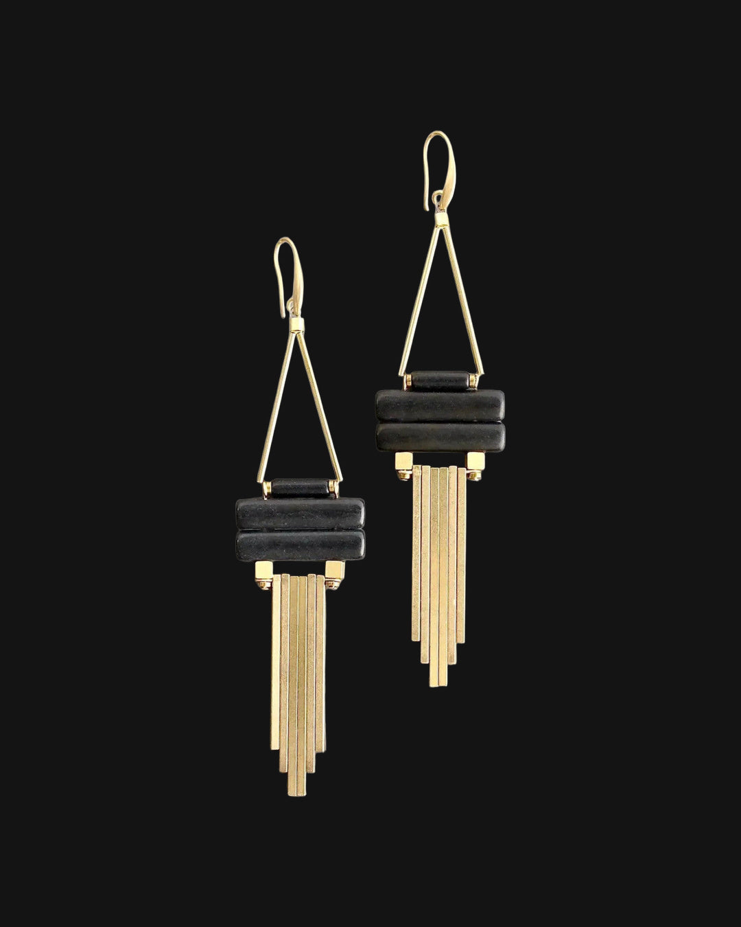 Chandelier earrings with stacked black magnesite bars and gold-plated brass fringe, made in the USA, shown on a black background